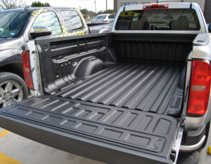 Pickup bed with spray on liner