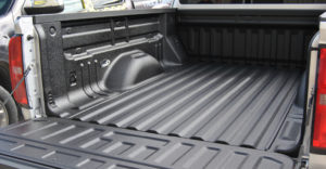 Pickup bed with spray on liner